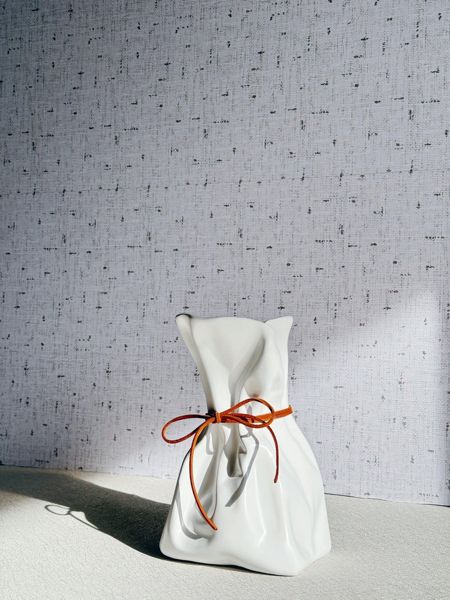 Ivory Vase with faux leather bow
