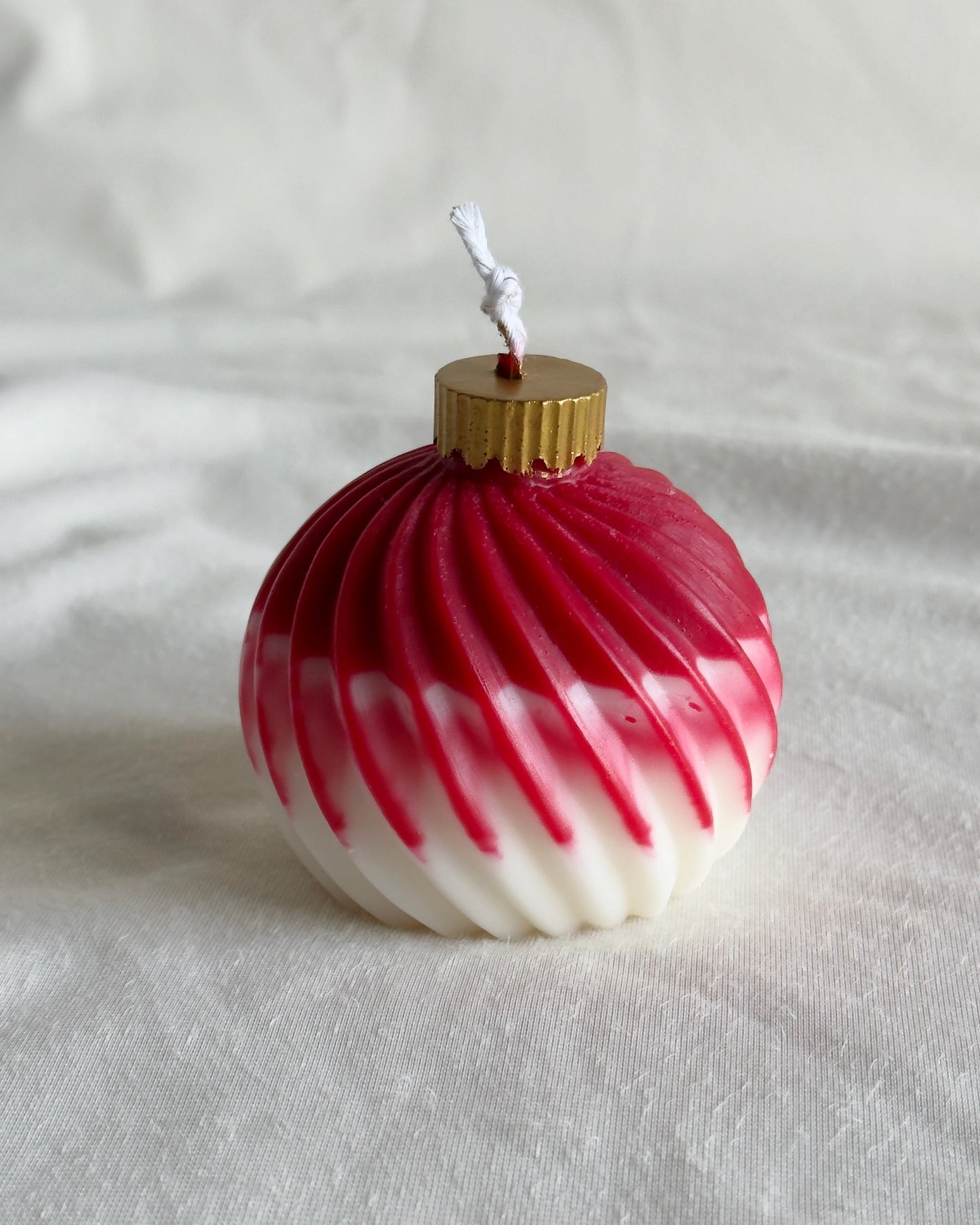 Decorative Christmas ornament candle with red and white pattern 