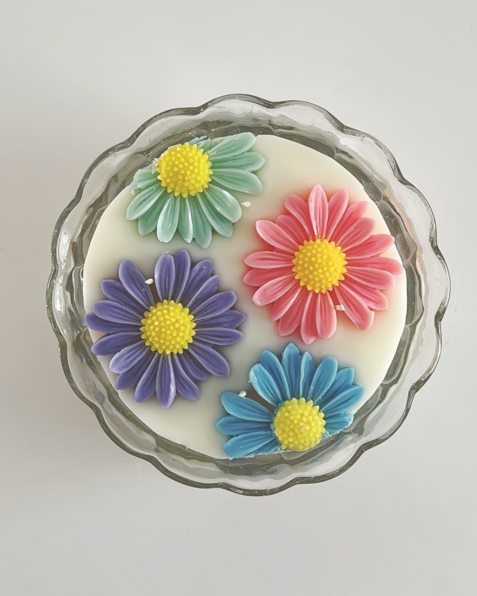 Decorative spring candle with colorful flower designs 