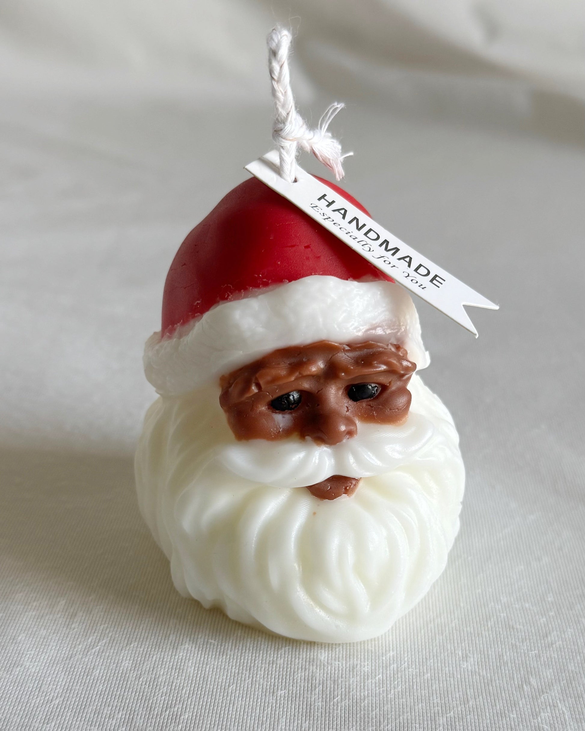 black santa holiday candle