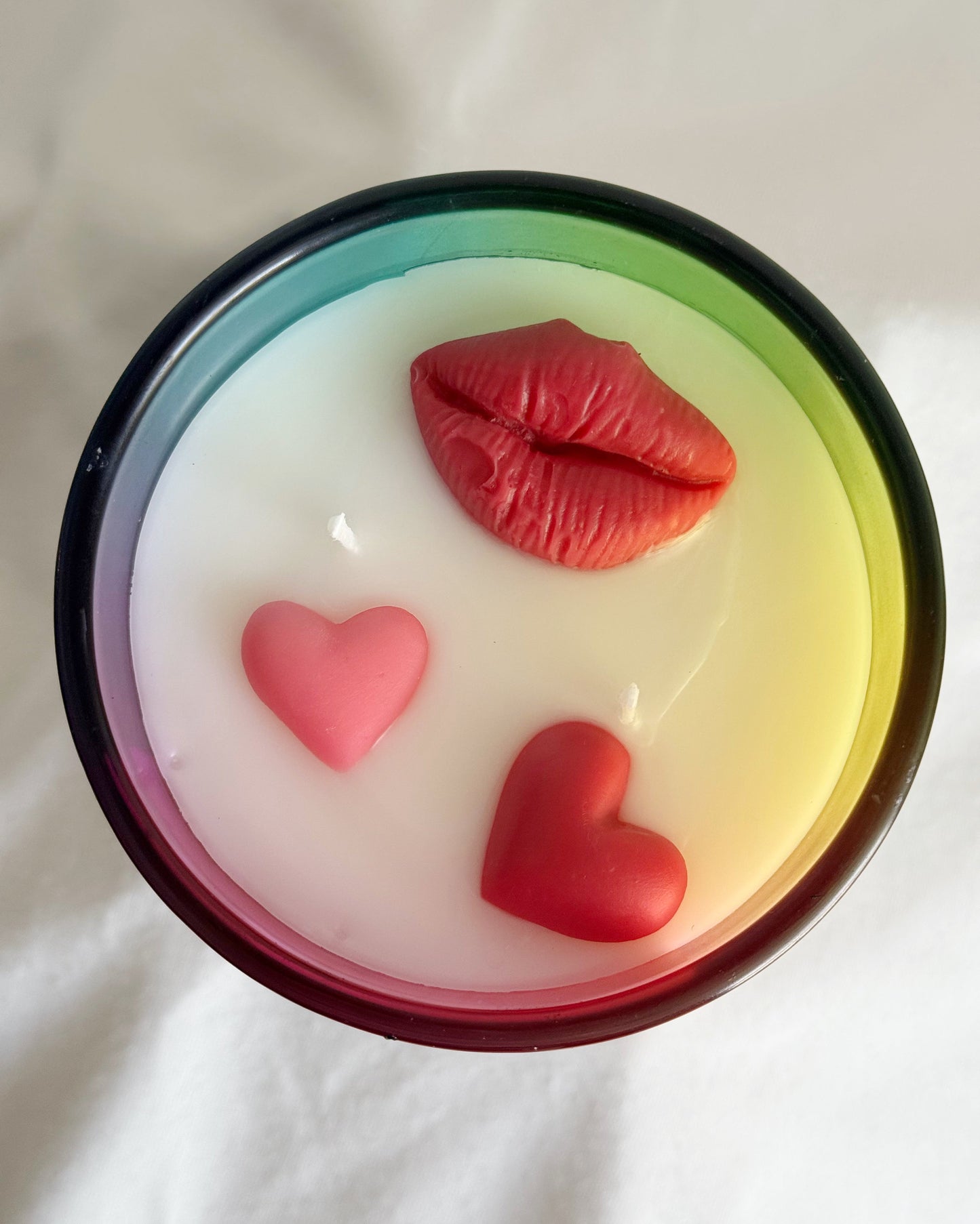 Valentine's Day Candle with red lips and hearts on a white background