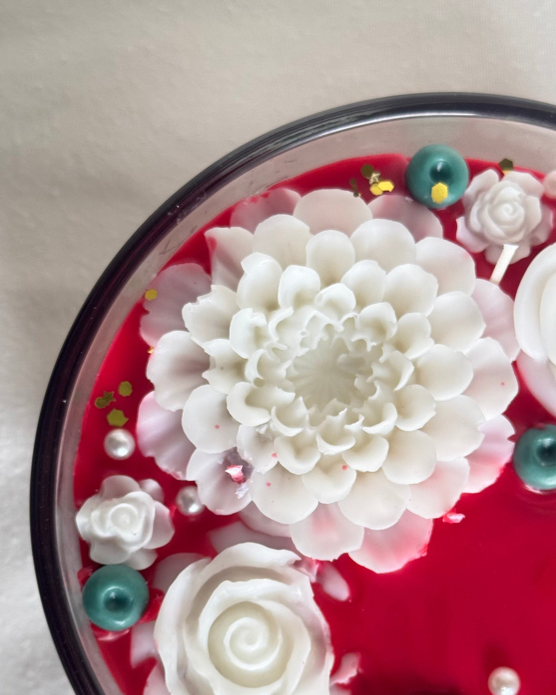 Cinnamon Chai decorative candle red candle white flowers