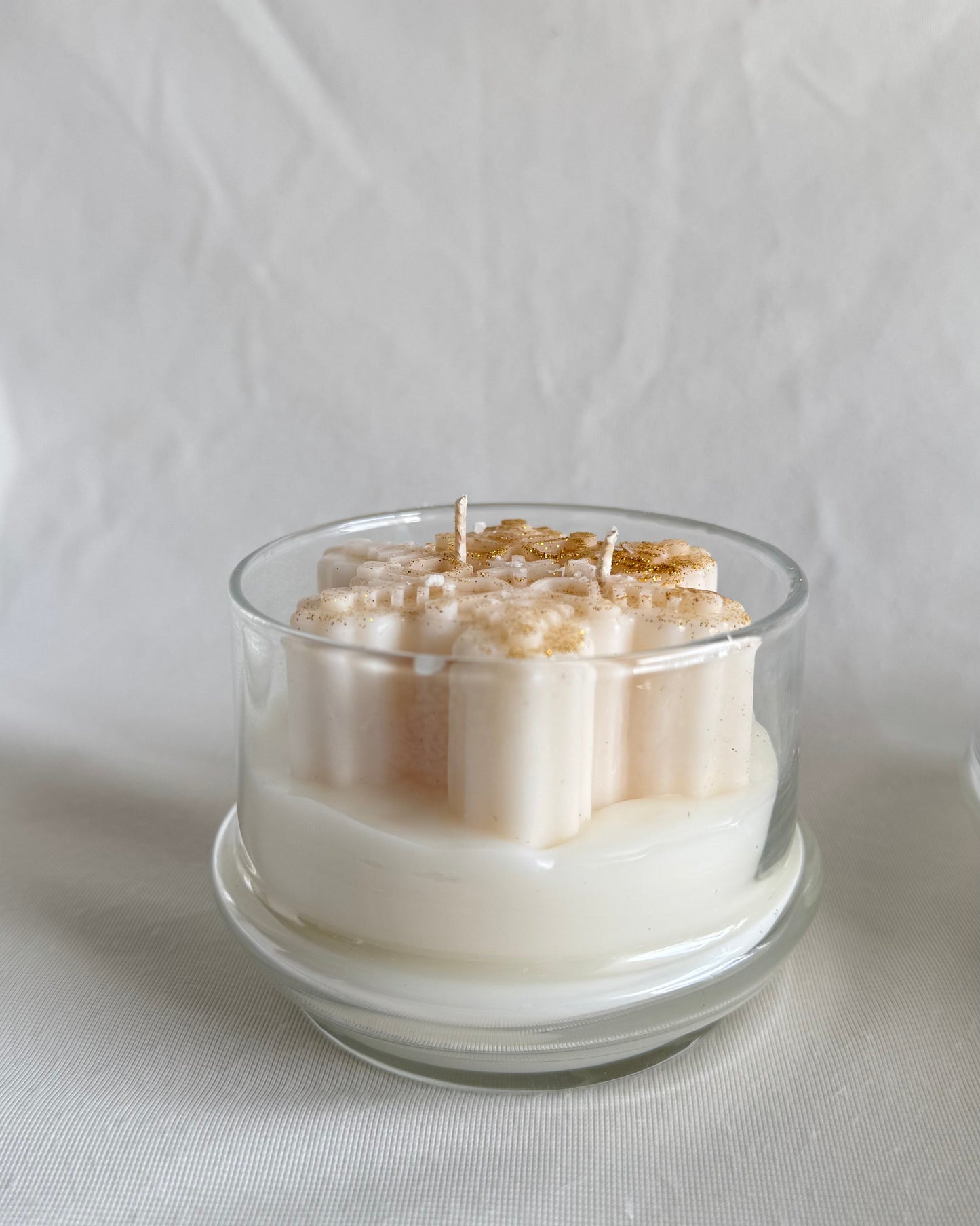 Christmas snowflake candle in glass cloche with hot apple cider fragrance