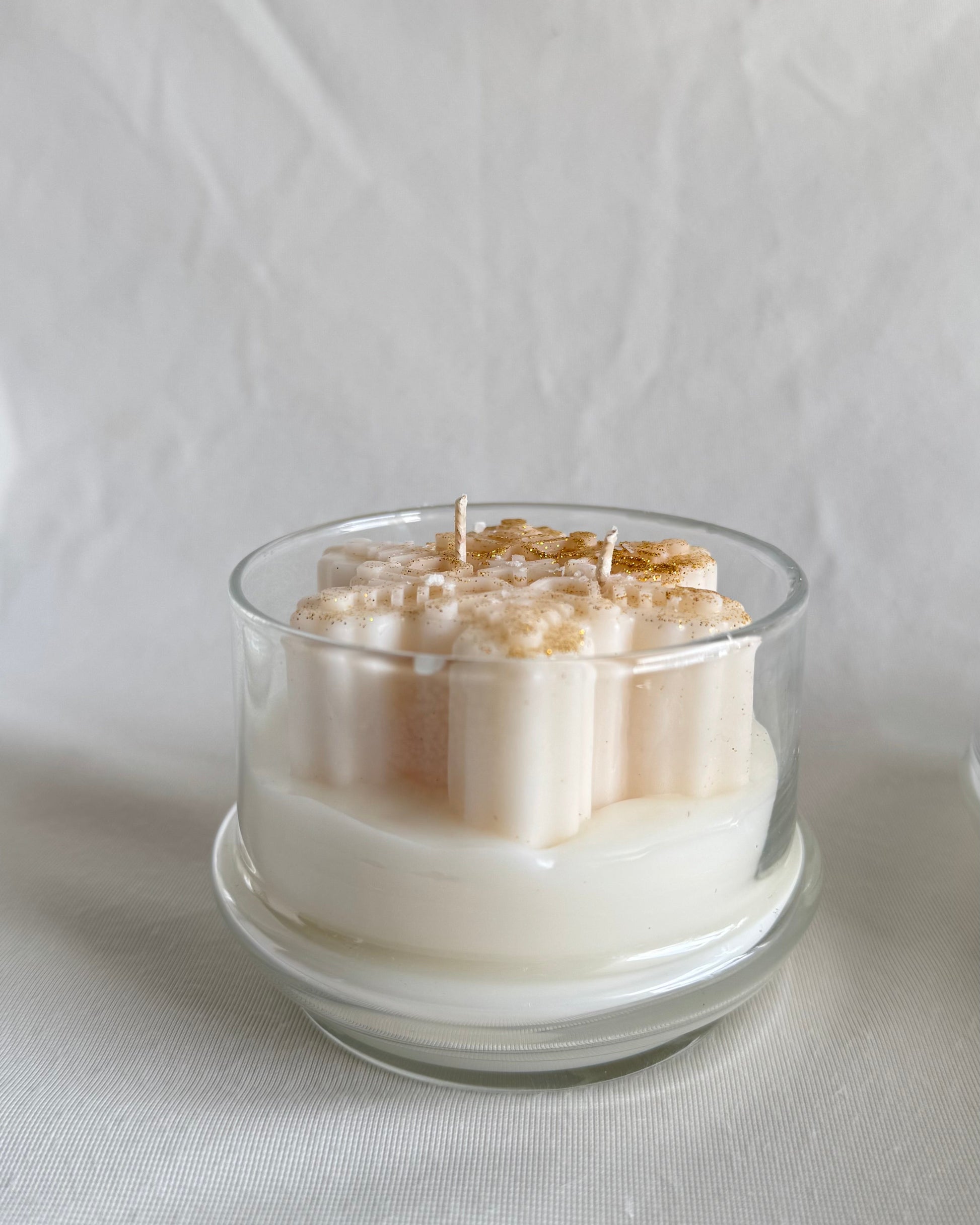 Christmas snowflake candle in glass cloche with hot apple cider fragrance