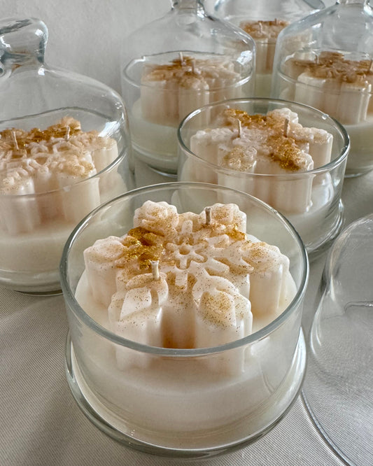 snowflake candle in glass cloche with hot apple cider fragrance